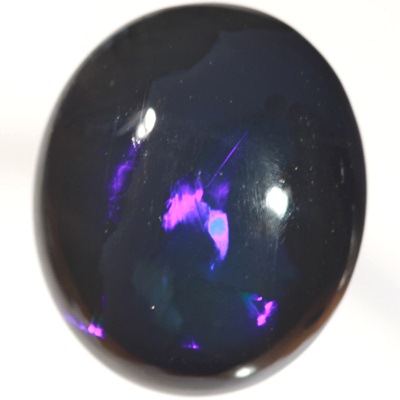 SOLID BLACK OPAL Huge opal with rolling flashes of electric blue. SEE VIDEO